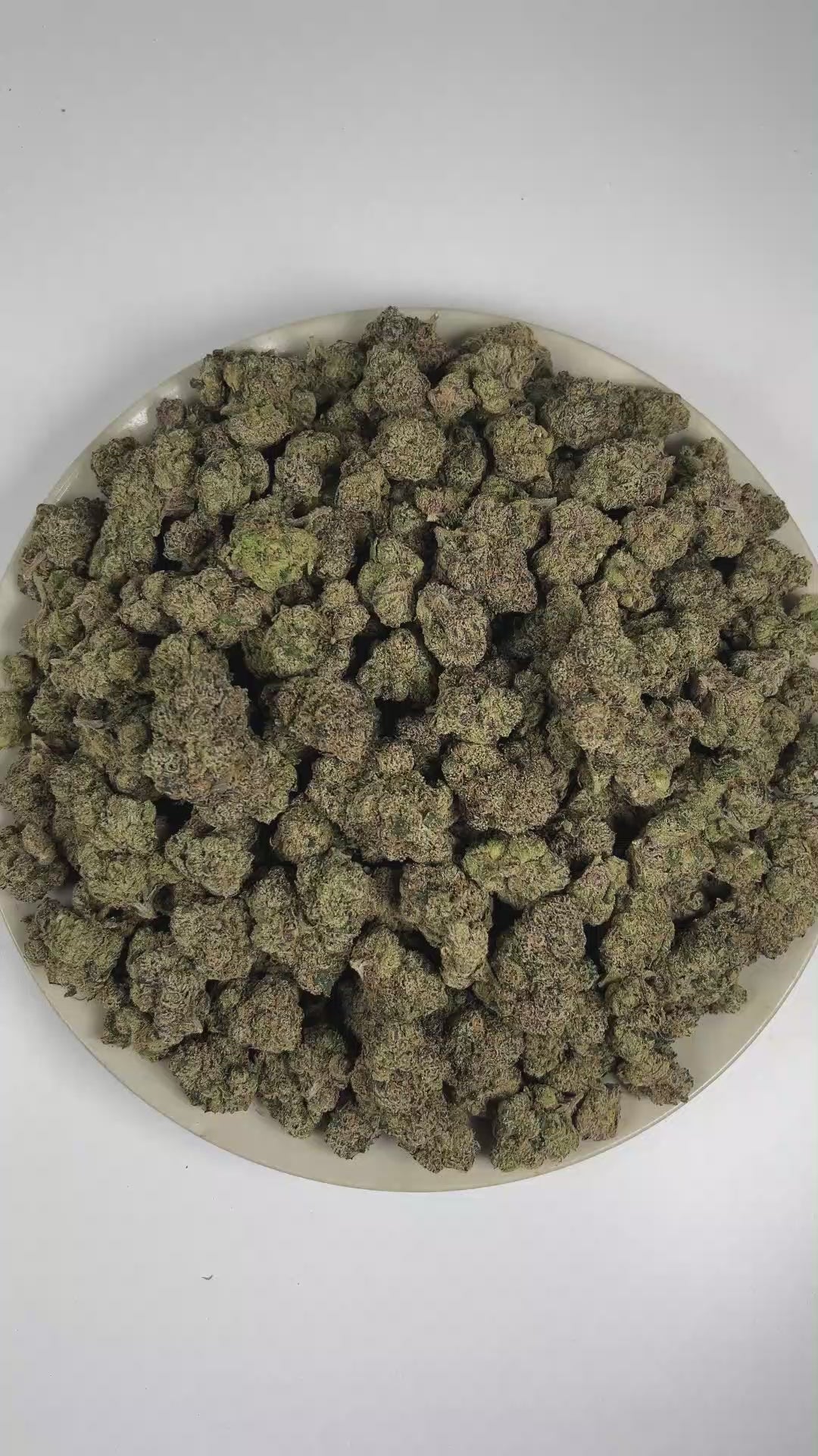 PUFFY Tiger's Blood is a lush, premium indica THCa strain known as a select phenotype carrying the iconic characteristics of OG Kush. The aroma is a luscious blend of ripe strawberry and juicy watermelon, layered with a subtle touch of warm spices. Visually, dense forest green buds with purple hues and fiery orange pistils are coated in sticky trichomes. Consumers often describe a sophisticated experience marked by uplifting euphoria, deep relaxation, and a brighter mood. 