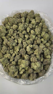 PUFFY Bubblegum is a premium, balanced hybrid THCa strain bred from the classic Indiana Bubblegum and an unknown indica, offering a unique blend of effects and sensory appeal. It boasts a sweet, candy-like flavor layered with fruity undertones, perfectly complemented by a gassy, earthy aroma. Visually, buds are rounded and display light to medium green hues, accented with vibrant pink or orange pistils, making them as eye-catching as they are enjoyable. Consumers often report a euphoric and uplifted mood, g