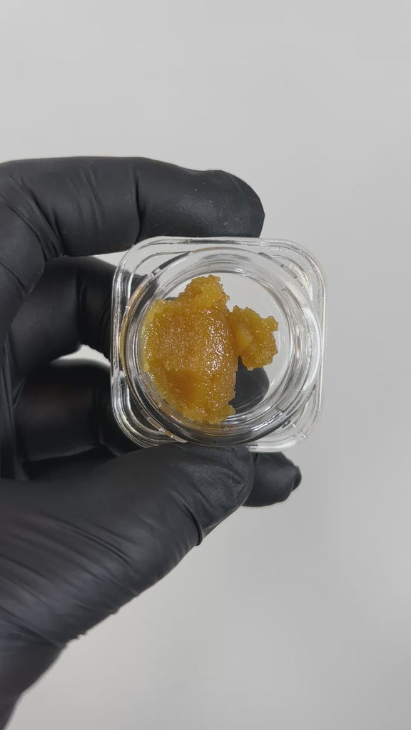 PUFFY Star Queen Badder: is a premium hybrid concentrate known for its rich, sweet caramel-vanilla flavor and powerful, long-lasting effects. Its bold aroma features a unique blend of funk, sharp cheese, and savory garlic, making it a standout choice for connoisseurs seeking a flavorful and potent experience.
