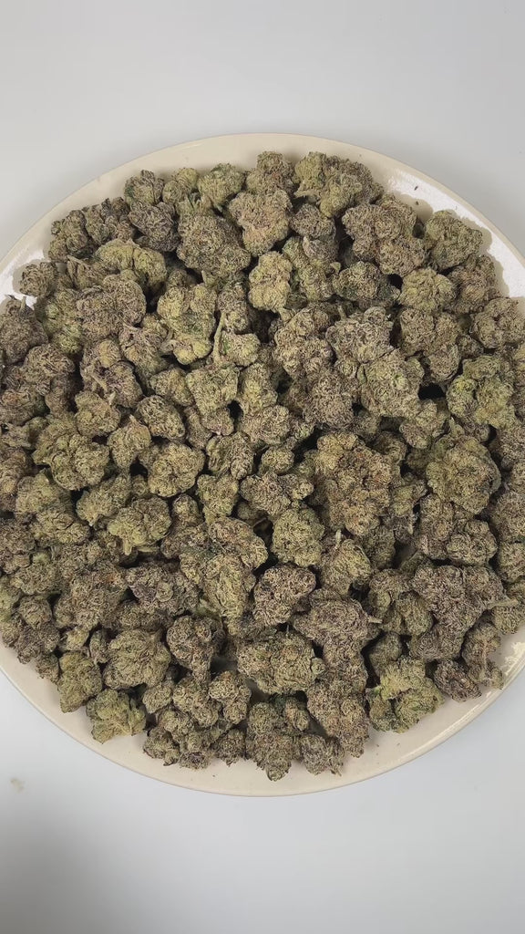 PUFFY Pink Picasso is a balanced hybrid THCa strain hailing from the renowned cross of Candyland and OZ Kush. The aroma is a bold and intriguing blend of gassy, sweet candy, and sharp chemical notes. Visually, dense lush green buds with purple hues and fiery orange pistils are coated in sticky trichomes. Consumers often report feeling euphoric, creatively inspired, motivated, joyful, and uplifted, experiencing a bright and energizing mental boost.