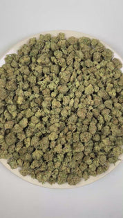 PUFFY Toad Venom (smalls) is a balanced hybrid THCa strain resulting from the strategic pairing of Animal Face and Sin Mintz. The aroma opens with a bold savory character layered with sharp onion notes and a pungent gassy finish. Visually, the buds are dense, with forest green and purple tones, bright orange pistils, and a frosty trichome coating. Consumers often report an initial euphoric uplift that enhances creativity, focus, and overall mood, followed by a smooth, soothing body relaxation that gently se