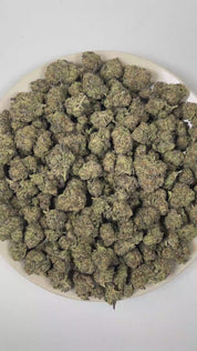 PUFFY China White is an indica-dominant hybrid THCa strain created through the strategic union of White Rhino and Chinese Indica . The aroma is rich and inviting, blending freshly baked dough notes with smooth creamy sweetness and the warm, sugary scent of freshly baked cookies. Visually, dense forest green buds with purple hues and fiery orange pistils are coated in sticky trichomes. Consumers often report a euphoric mood lift accompanied by deep physical relaxation and a peaceful mental calm that encourag