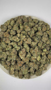 PUFFY Cadillac Rainbow is a balanced hybrid THCa strain expertly crafted from a potent cross between Pure Michigan and Runtz. The aroma opens with pungent onion notes, complemented by bold fuel undertones and a rich, earthy woodiness. Visually, dense forest green buds with purple hues and fiery orange pistils are coated in sticky trichomes. Consumers often report an elevated sense of euphoria and uplifting clarity, complemented by a refined wave of relaxation that leaves them feeling balanced, serene, and d