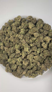 PUFFY Lava Cake is an indica-dominant hybrid THCa strain, crafted from the legendary lineage of Cross of Thin Mint × Grape Pie. The aroma is a rich blend of cookies, creamy vanilla, and a hint of dank sweetness, creating a warm and indulgent scent profile. Visually, the buds are dense with purple highlights, vibrant greens, and bright orange hairs, all dusted in frosty trichomes. Consumers often describe an initial wave of cerebral euphoria and light uplift before the experience shifts into deep physical ca