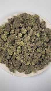 PUFFY Black Mamba is an indica-dominant hybrid THCa strain expertly bred from the powerful pairing of Granddaddy Purple and Black Domina. The aroma opens with sweet, juicy berries, blossoms into delicate floral notes, and finishes with rich, earthy wood undertones. Visually, dense forest green buds with purple hues and fiery orange pistils are coated in sticky trichomes. Consumers often report a euphoric, deeply relaxing experience that melts away tension while encouraging a healthy appetite. 