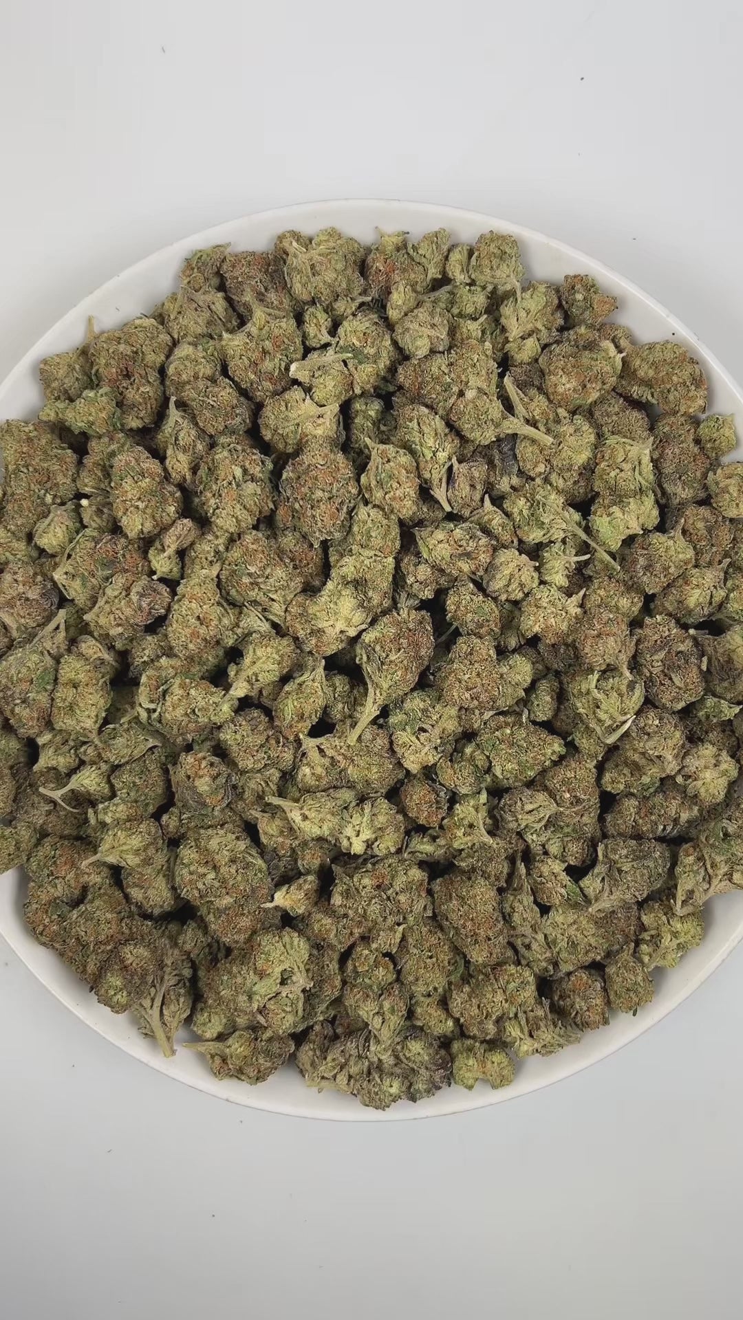 PUFFY Double Baked Cake is an indica-dominant hybrid THCa strain, born from the flavorful union of Layer Cake and Wedding Cake. The aroma is a robust mix of herbal, earthy, and gassy notes, giving it a rich and pungent character. Visually, it features dense light green buds with purple hues and vibrant orange pistils, all coated in a frosty layer of sticky trichomes. Consumers often report a relaxing body high that begins with an uplifting, mood‑enhancing onset of calm, happy sensations before gradually mel