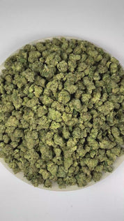 PUFFY Toad Venom (smalls) is a balanced hybrid THCa strain resulting from the strategic pairing of Animal Face and Sin Mintz. The aroma combines sharp chemical notes, pungent cheese, and a strong fuel-like scent. Visually, the buds are dense, with forest green and purple tones, bright orange pistils, and a frosty trichome coating. Consumers often report an initial euphoric uplift that enhances creativity, focus, and overall mood, followed by a smooth, soothing body relaxation that gently settles the experie