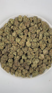 PUFFY Wedding Cake is an indica-dominant hybrid THCa strain created by crossing Triangle Cherry Pie and Girl Scout Cookies (GSC). The aroma is a bold and intriguing blend of gassy fuel notes, refreshing mint, and a distinctive skunky undertone. Visually, the buds are dense and vibrant, with forest green and purple hues coated in frosty trichomes and bright orange pistils. Consumers often report a euphoric, uplifted mood paired with a relaxing body high, along with a creative and social spark in lighter use.