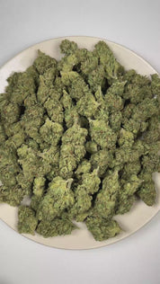 PUFFY Omerta OG is an indica-dominant hybrid THCa strain born from the iconic lineage of True OG and Pure Kush. The aroma is rich with pungent OG, fresh pine, and a bold diesel finish. Visually, dense forest green buds with hints of purple are threaded with fiery orange pistils and coated in a sparkling layer of sticky trichomes. Consumers often report feeling euphoric and uplifted, with waves of happiness and energetic effects that gradually give way to a calm, relaxed state. 