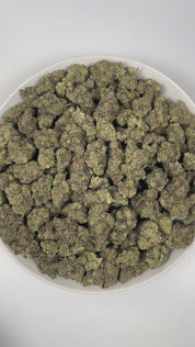 PUFFY Purple Kush is a pure indica THCa strain originating from a cross of Hindu Kush and Purple Afghani. The aroma is a bold blend of classic Kush, pungent earthiness, and a sharp hint of onions. Visually, dense forest green buds with purple hues and fiery orange pistils are coated in sticky trichomes. Consumers often report a blissful sense of euphoria, deep relaxation, and a noticeable boost in appetite.