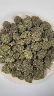 PUFFY Grape Gelato is an indica-dominant hybrid THCa strain, born from the renowned fusion of Grape Kush and Gelato #33. The aroma opens with vibrant fruity sweetness, followed by rich creamy undertones and finished with a bold, lingering gassy depth. Visually, dense green buds with purple hues and fiery orange pistils are coated in sticky trichomes. Consumers often report a euphoric, energetic, and happy high that encourages lighthearted conversation and social ease while delivering a relaxing, mood‑liftin