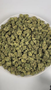PUFFY Mint Pie is an indica-dominant hybrid THCa strain, born from the renowned cross of Payton’s Pie and Ice Cream Mints. The aroma opens with refreshing mint, grounded by earthy undertones, and rounded out with a smooth hint of vanilla. Visually, the dense buds display deep forest-green with amber hues, vibrant orange pistils, and a generous coating of sparkling trichomes. Consumers often report a blissful, head-to-toe high that lifts the mind while melting tension from the body, perfect for unwinding or 