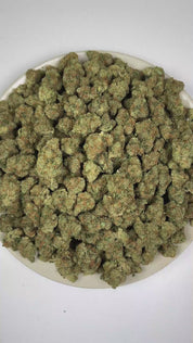 PUFFY Purple Milk is a balanced hybrid THCa strain born from the flavorful fusion of Purple OG Kush and Bubba Kush. The aroma is rich and inviting, blending creamy vanilla with sweet berry and ripe grape notes. Visually, dense forest green buds with purple hues and fiery orange pistils are coated in sticky trichomes. Consumers often report a refined sense of euphoria accompanied by focused clarity and a smooth, relaxed state.