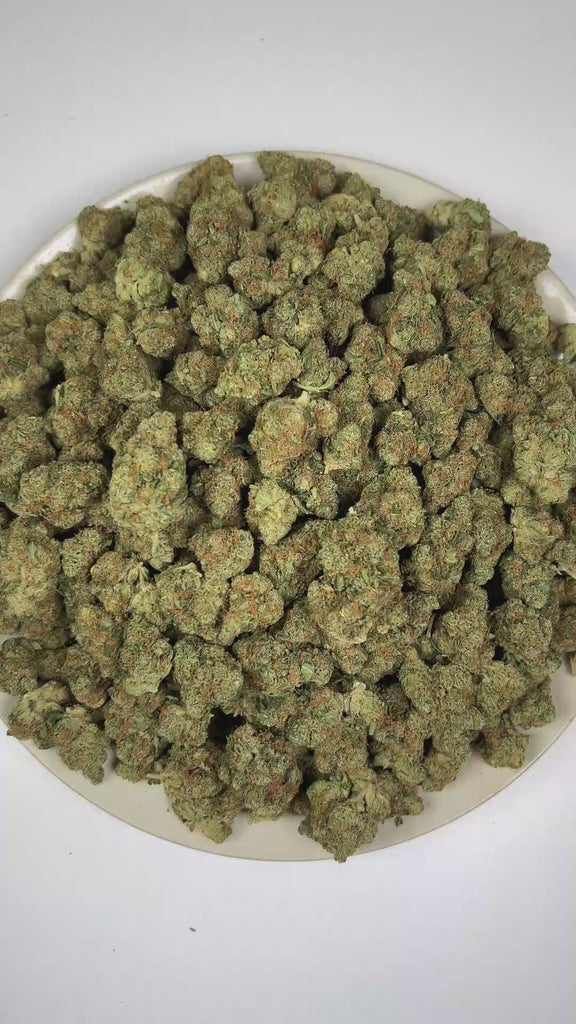 PUFFY Purple Milk is a balanced hybrid THCa strain born from the flavorful fusion of Purple OG Kush and Bubba Kush. The aroma is rich and inviting, blending creamy vanilla with sweet berry and ripe grape notes. Visually, dense forest green buds with purple hues and fiery orange pistils are coated in sticky trichomes. Consumers often report a refined sense of euphoria accompanied by focused clarity and a smooth, relaxed state.