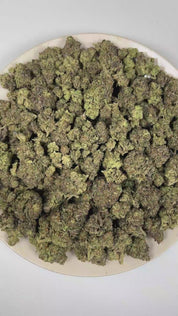 PUFFY Funky Runtz is a balanced hybrid THCa strain whose exact genetics remain unconfirmed, leaving its true lineage unknown. The aroma is a delightful blend of sweet candy and rich creamy notes, rounded out by a smooth, fruity finish. Visually, dense deep forest green buds with purple hues and fiery orange pistils are coated in sticky trichomes. Consumers often report euphoric effects that bring mental clarity, fuel creativity, and promote peaceful relaxation. 
