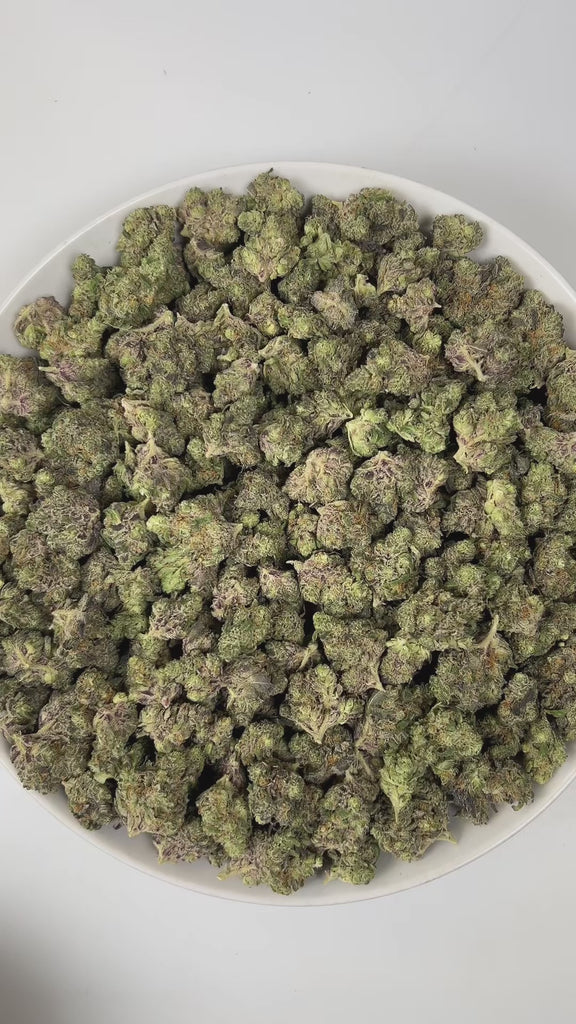 PUFFY Truffle is an indica-dominant hybrid THCa strain, expertly crafted from the renowned pairing of ZKZ and Cherry Noir. The aroma is a fragrant blend of fresh herbal notes layered with warm spices and delicate floral undertones, creating a smooth and pleasantly uplifting scent profile. Visually captivating, the buds are thick and resinous, shimmering with frosty trichomes, while vibrant orange pistils thread through shades of dark green and purple. Consumers often report a euphoric uplift that gently set
