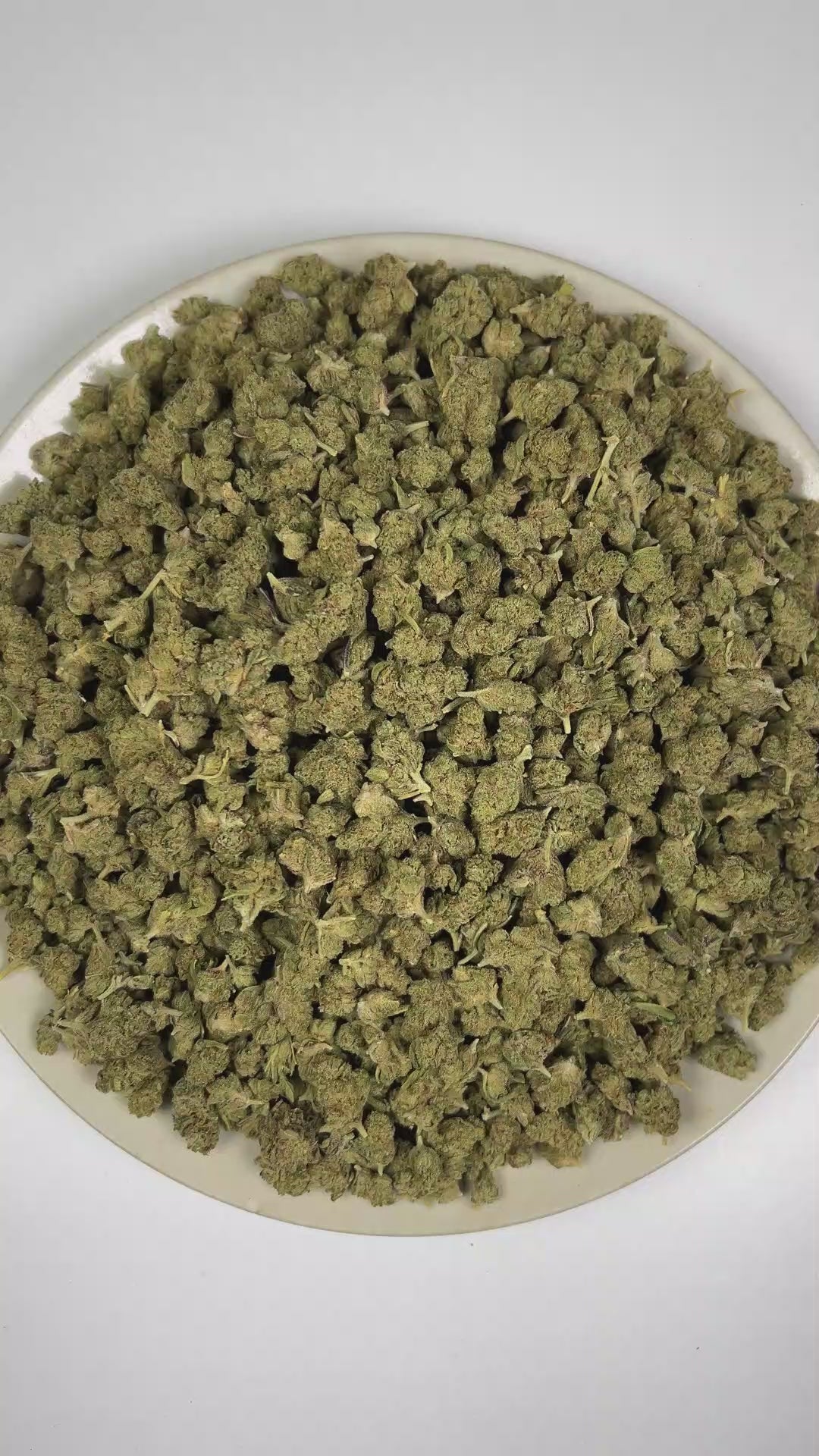 PUFFY Garlic Bud (smalls) is a balanced hybrid THCa strain rooted in the Afghani Indica landrace, known for its traditional Afghan heritage and rich, earthy traits. The aroma features earthy notes complemented by fresh herbal undertones and rich, woody scents. Visually, dense forest green buds with purple hues and fiery orange pistils are coated in sticky trichomes. Consumers often report an initial cerebral uplift with euphoria, elevated mood, and heightened creativity, followed by increased appetite, pote