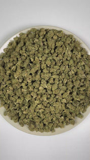PUFFY Garlic Bud (smalls) is a balanced hybrid THCa strain rooted in the Afghani Indica landrace, known for its traditional Afghan heritage and rich, earthy traits. The aroma features earthy notes complemented by fresh herbal undertones and rich, woody scents. Visually, dense forest green buds with purple hues and fiery orange pistils are coated in sticky trichomes. Consumers often report an initial cerebral uplift with euphoria, elevated mood, and heightened creativity, followed by increased appetite, pote