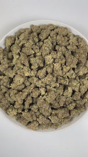 PUFFY Frosted Donut is an indica-dominant  hybrid THCa strain, expertly crafted from a potent cross between Girl Scout Cookies and Louis XIII. The aroma is a bold and invigorating blend of fresh mint, sharp pungency, and a distinct gassy undertone. Visually, the dense buds display bright green and deep purple hues, dotted with orange pistils and coated in sparkling trichomes. Consumers often report an initial euphoric and uplifting cerebral buzz that elevates mood, gradually transitioning into deep relaxati