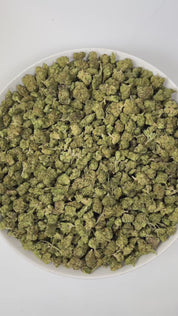 PUFFY Charlotte’s Web (smalls) is a sativa-dominant hybrid THCa strain. The exact parent genetics were never disclosed, but it is believed to have been bred from high-CBD hemp with extremely low THC levels. The aroma is a delightful blend of sweet strawberry, smooth cream, and a bold hint of diesel, creating a rich and enticing fragrance experience. Visually, the dense buds display green tones with deep purple hues, vibrant orange pistils, and a frosty trichome coating. Consumers often report feeling euphor