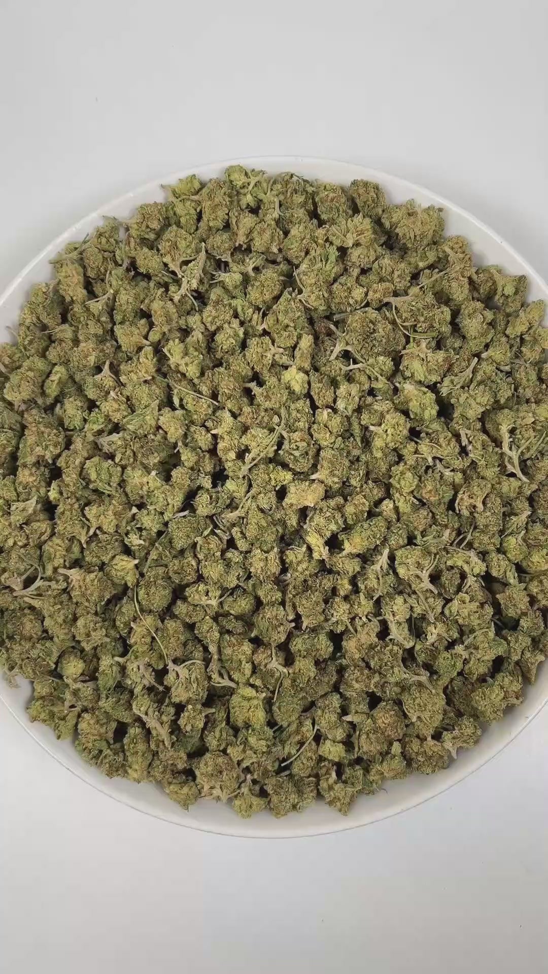 PUFFY Almond Mochi (smalls) is a balanced hybrid THCa strain, crafted from the flavorful cross of Mochi and Biscotti Dough. The aroma is a bold and intriguing blend of diesel, nutty undertones, and a subtle hint of vanilla, creating a rich and inviting scent profile. Visually, dense deep green buds with hints of purple are threaded with fiery orange pistils and coated in a sparkling layer of sticky trichomes. Consumers often report a balanced high combining happy, creative, and euphoric effects with calming