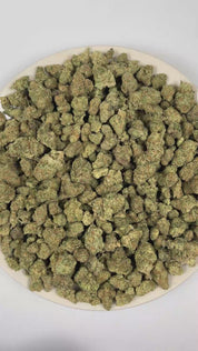 PUFFY Assorted Exotics is a curated assortment of exotic strains, featuring Blue Cookie Monster, Pineapple Fizz, Papaya Punch, Red Velvet, Maria, Gelato, Lemon Kush, Rockets, Dutch Punch, Banana Jax, and Banana OG x Banana Frosting. The aroma is a bold fusion of diesel fuel notes, bright citrus zest, and pungent skunky undertones, creating a sharp and intensely fragrant scent profile. 