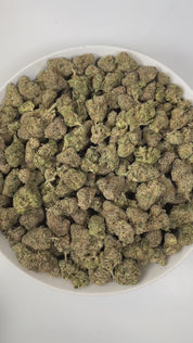 PUFFY Pink Certz is a balanced hybrid THCa strain, created from the potent pairing of The Menthol and Grape Gasoline. The aroma is a bold blend of sweet candy notes, sharp gassy undertones, and pungent chemical hints, creating a striking and memorable scent profile. Visually, dense frosty buds glow neon green with golden hints and pink-orange hairs, coated in sparkling, gem-like trichomes. Consumers often experience an uplifting, clear-headed euphoria that sparks creativity and focus, followed by gentle bod