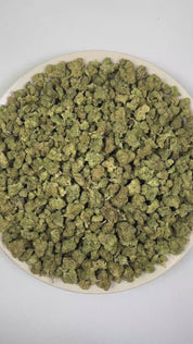 PUFFY Hash Burger (smalls) is an indica-dominant hybrid THCa strain, born from the masterful cross between Han Solo Hash Plant and Double Burger. The aroma presents a savory blend led by sharp onion and rich garlic notes, rounded out by warm, earthy spices that add depth and complexity. Visually, dense forest-green buds with purple hues and fiery orange pistils are coated in sticky trichomes. Consumers often report an experience that begins with a euphoric cerebral rush, gradually easing into deep body rela