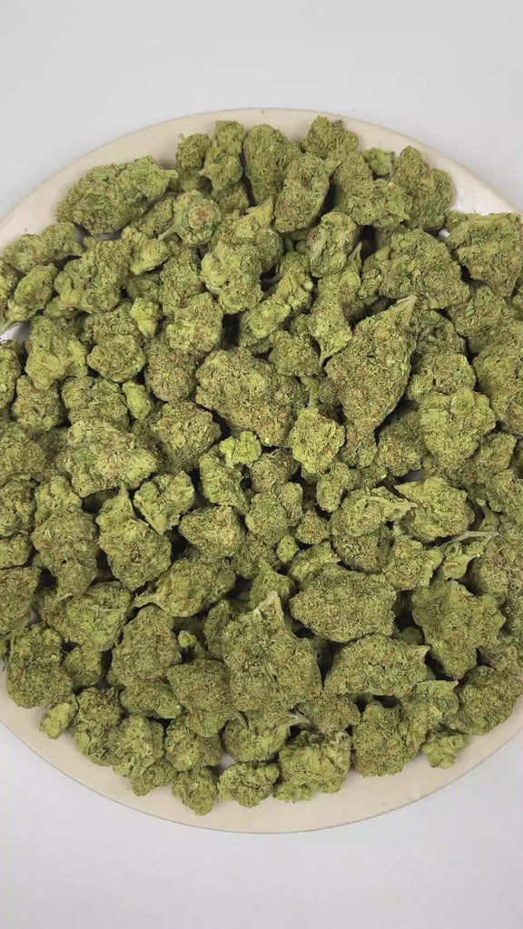PUFFY Guava is a sativa-dominant hybrid THCa strain bred through the premium union of Gelato and Stardawg. The aroma opens with bold cheesy notes, followed by a pungent earthiness and an unmistakably funky, stinky finish. Visually, the buds are dense, with green tones, bright orange pistils, and a frosty trichome coating. Consumers often report a euphoric shift in mood paired with an uplifted, content state that enhances creativity and supports a more focused, sharp mental clarity.  