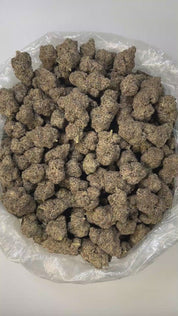 PUFFY Black Truffle is a premium indica-dominant hybrid THCa strain, born from the flavorful cross of Gelato 33 and Chocolate Kush. Aroma is rich and inviting, doughy with warm chocolatey undertones and a smooth, creamy finish. Visually, the dense buds range from dark green to deep purple, coated in a thick layer of frosty trichomes and highlighted by bright orange hairs. Consumers often report a euphoric, uplifting mental buzz followed by deep body relaxation and a calming effect, making it ideal for eveni