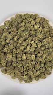 PUFFY High Tide is a sativa-dominant hybrid THCa strain, officially recognized as an unknown genetic cross with no confirmed lineage. The aroma opens with fragrant herbal notes, highlighted by the savory character of fresh thyme and layered with the dry, woody essence of cedar. Visually, dense forest green buds with purple hues and fiery orange pistils are coated in sticky trichomes. Consumers often report an uplifting and euphoric experience marked by enhanced creativity, sharpened focus, greater social ea