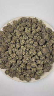 PUFFY Tiffany & OG is a balanced hybrid THCa strain, a masterful fusion of the legendary True OG and OG Kush lineage. The aroma opens with rich doughy notes layered with earthy herbal undertones and a warm woody finish. Visually, dense forest green buds with purple hues and fiery orange pistils are coated in sticky trichomes. Consumers often report a euphoric and uplifted mood accompanied by a gentle sense of physical ease and an alert, steady focus with improved mental clarity. 