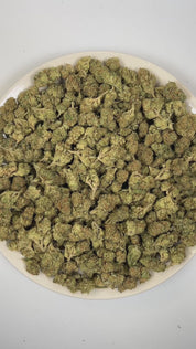 PUFFY Green Slime is a balanced hybrid THCa strain with an unverified and unofficially documented genetic lineage. The aroma is a vibrant blend of tropical fruit, crisp green apple, and sweet, candy-like notes that create a bright, fruity, and pleasantly sugary scent profile. Visually, dense forest green buds with purple hues and fiery orange pistils are coated in sticky trichomes. Consumers often report feelings of euphoria and elevated mood, accompanied by a gently relaxed body sensation and a mild boost 