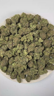 PUFFY Gas & Glue is a balanced hybrid THCa strain born from the powerhouse genetics of The White, Girl Scout Cookies, and GG4. The aroma opens with bold gassy notes, layered with pungent fuel undertones and finished by a rich, earthy tobacco character. Visually, dense forest green buds with purple hues and fiery orange pistils are coated in sticky trichomes. Consumers often report a euphoric, soothing sensation, accompanied by a balanced blend of cerebral uplift and full-body relaxation that leaves them fee