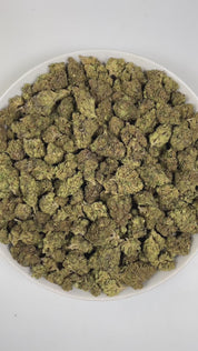 PUFFY Zushi is an indica-dominant hybrid THCa strain, crafted from the distinctive pairing of Original Z and Kush Mints. The aroma is a bold and intriguing blend of gassy pungency, rich woody undertones, and a sweet, ripe hint of grape that lingers on the senses. Visually, dense forest green buds with purple hues and fiery orange pistils are coated in sticky trichomes. Consumers often report a clear-headed sense of inspiration, heightened creativity, and balanced energy that leaves the mind feeling relaxed.