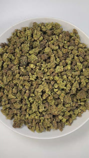 PUFFY Chimera Smalls is a well-balanced hybrid strain born from the legendary cross between White Widow and Blueberry lineages. The aroma is a lush blend of ripe papaya, sweet apricots, and a rich, wine-like depth that adds a sophisticated finish. Visually, the buds are dense and heart-shaped, showcasing dark olive green hues with bright undertones, thin orange hairs, and a sparkling coat of golden-white trichomes. Consumers often report an uplifting cerebral buzz that sparks creativity and euphoria, follow