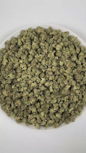 PUFFY Wedding Punch (smalls) is a balanced hybrid THCa strain, created by crossing Wedding Cake and Purple Punch. The aroma is a rich blend of creamy, herbal, and pungent notes, creating a deeply inviting and distinctive scent. Visually, dense deep green buds with purple hues and fiery orange pistils are coated in sticky trichomes. Consumers often report a soothing sense of relaxation paired with mental clarity, accompanied by an uplifted mood and happy, euphoric sensations.
