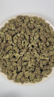 PUFFY Frostitute is an indica-dominant hybrid THCa strain born from G13 and an unknown indica lineage hidden from public records. The aroma opens with a bold, dank intensity, layered with earthy herbal undertones and finished by a crisp, pine-forward freshness. Visually, dense herbal green buds with purple hues and fiery orange pistils are coated in sticky trichomes. Consumers often report an uplifting euphoric state paired with a soothing mental ease and a steady, mood-enhancing effect that brings the mind