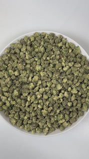 PUFFY Luxor (smalls) is an indica-dominant hybrid THCa strain, crafted from the unique union of Triangle Kush and SinMint Cookies. The aroma is a zesty burst of lime, layered with warm woody undertones and a subtle gassy note, creating a bold, energizing, and slightly earthy fragrance. Visually, dense deep green buds with purple hues and fiery orange pistils are coated in sticky trichomes. Consumers often report experiencing euphoria, an uplifted mood, heightened creativity, and a state of relaxed, focused 