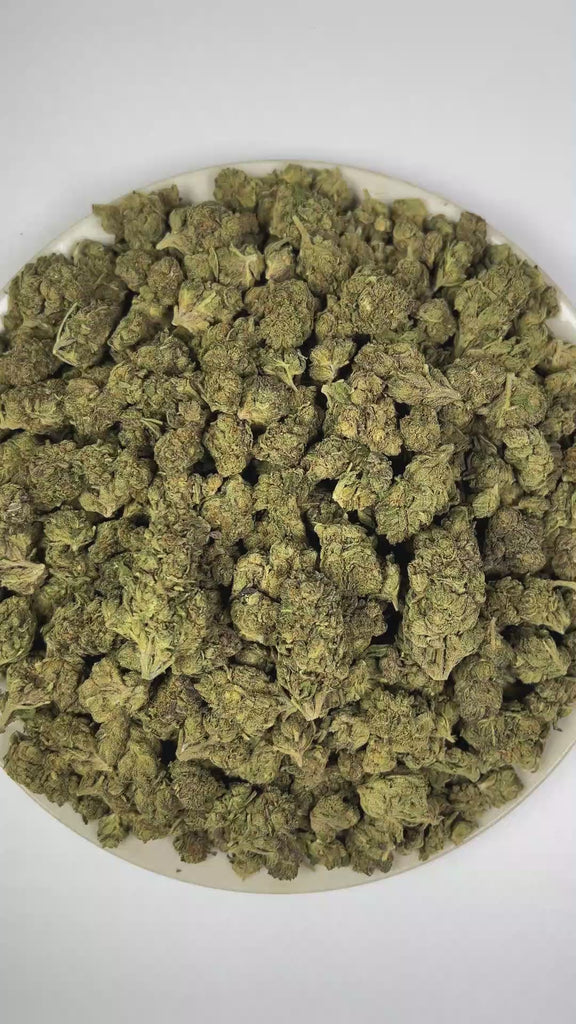 PUFFY Rainbow Candy is an indica-dominant hybrid THCa strain created by crossing Original Z and Dosidos. The aroma features a delightful blend of sweet candy notes, zesty citrus, and a bold, gassy undertone. Visually, dense forest green buds with purple hues and fiery orange pistils are coated in sticky trichomes. Consumers often report a euphoric and uplifting experience paired with a soothing sense of relaxation.