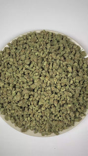 PUFFY MAC 1 (smalls) (Miracle Alien Cookies) is a balanced hybrid THCa strain, from the renowned pairing of Alien Cookies F2 with a Miracle 15. The aroma is a bold blend of savory cheesy notes, pungent skunk, and a sharp hint of cracked black pepper. Visually captivating, the buds are thick and resinous, shimmering with frosty trichomes, while vibrant orange pistils thread through shades of dark green and purple. Consumers often report that it delivers euphoric cerebral uplift and relaxing body effects, lea