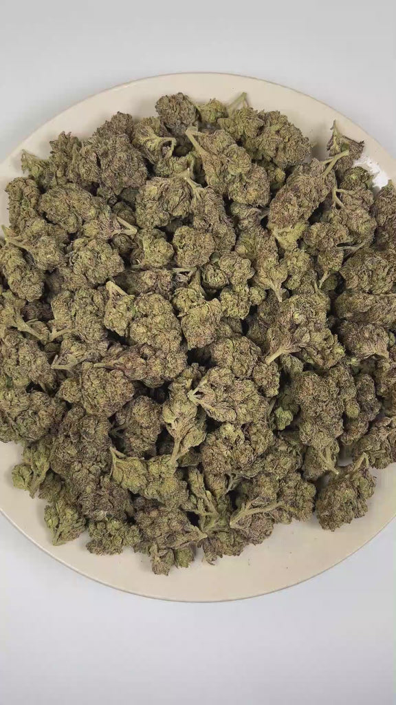 PUFFY Pink Runtz is a well-balanced hybrid THCa strain derived from the skillfully blended cross of Original Z and Gelato. The aroma opens with vibrant fruity sweetness, layered with pungent fuel notes and bold chemical undertones. Visually, dense deep forest green buds with purple hues and fiery orange pistils are coated in sticky trichomes. Consumers frequently describe the experience as starting with a cerebral rush that brings a wave of euphoria and an uplifted mood, gradually transitioning into a calmi