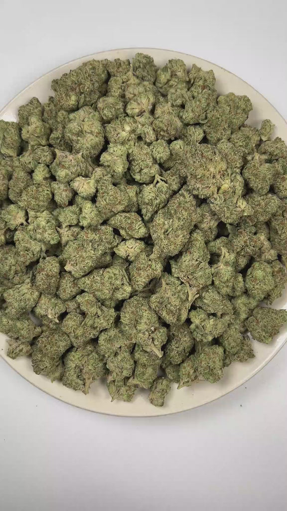PUFFY ORZ is an indica-dominant hybrid THCa strain derived from the celebrated fusion of  Cookies and Cream and Secret Weapon. The aroma is rich and inviting, blending doughy sweetness with smooth vanilla notes and a warm, freshly baked cake finish. Visually, dense forest green buds with hints of purple are threaded with fiery orange pistils and coated in a sparkling layer of sticky trichomes. The consumers often report a euphoric experience accompanied by a calm, mentally relaxed state that gently soothes 