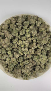 PUFFY Bubblegum is an indica-dominant hybrid THCa strain crafted from the nostalgic Indiana Bubble Gum genetics and a mysterious indica lineage. The aroma is a vibrant blend of fruity and citrus notes, finishing with a subtle fuel-like undertone. Visually, dense spring green buds with purple hues and fiery orange pistils are coated in sticky trichomes. Consumers often report feeling euphoric, blissful, and deeply relaxed, accompanied by an uplifted mood along with a spark of creativity and light cerebral st