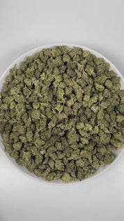 PUFFY Purple Gas (smalls) is an indica-dominant hybrid THCa strain, crafted from the renowned cross of Bubba Kush × Sour Diesel. The aroma bursts with rich fuel notes, layered with warm woody undertones and a hint of spicy complexity that awakens the senses. Visually, dense moss green buds with purple hues and fiery orange pistils are coated in sticky trichomes. Consumers often report a balanced high that leaves them feeling relaxed, euphoric, and happy, providing soothing relief for both mind and body.