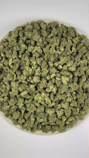 PUFFY Blue Dream (smalls) is a sativa-dominant hybrid THCa strain, crafted from the lush pairing of Blueberry and Haze. The aroma blends tropical fruit sweetness with zesty citrus notes and a bold fuel-like finish. Visually, dense forest green buds with purple hues and fiery orange pistils are coated in sticky trichomes. Consumers often report a euphoric, uplifting head high that flows into a gentle, motivating body buzz, perfect for clear, creative daytime energy.    