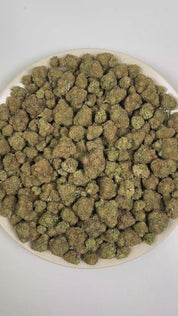 PUFFY Tiramisu is a sativa-dominant hybrid THCa strain, crafted from the decadent union of Wedding Cake and Gelato 45. The aroma is a rich blend of doughy, baked bread-like notes, soft sweetness, and smooth creamy undertones. Visually, dense forest green buds with purple hues and fiery orange pistils are coated in sticky trichomes. Consumers often report a euphoric, uplifted mood paired with bursts of energy, enhanced creativity, and focused mental clarity. 