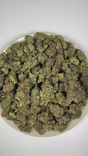 PUFFY Sour Tarts is a balanced hybrid THCa strain, crafted from the exquisite blend of Di Frutti and Karma Sour Diesel BX2. The aroma opens with a zesty burst of lemon, complemented by pungent diesel notes and a deep, earthy musk. Visually, dense forest green buds with purple hues and fiery orange pistils are coated in sticky trichomes. Consumers often report a euphoric lift in mood, an uplifting sense of well-being, enhanced creative flow, and a soothing wave of relaxation for a refined, harmonious experie