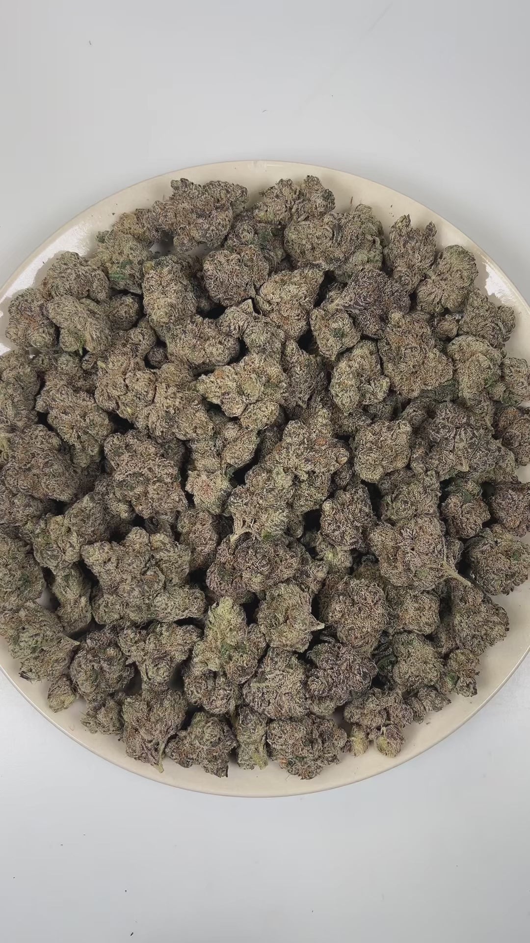 PUFFY Purple Pez is a balanced hybrid THCa strain created through the indulgent cross of Purple Punch and Candy Kush. The aroma delivers a bold fusion of ripe grape, sweet candy-like notes, and sharp gasoline fuel undertones. Visually, dense forest green buds with purple hues and fiery orange pistils are coated in sticky trichomes. Consumers often report an initial euphoric and happy mental uplift with enhanced creativity, followed by a gently relaxing body high that promotes calmness.