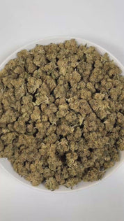 PUFFY Godfather OG is an indica-dominant hybrid THCa strain, crafted through the masterful union of the legendary XXX OG and the iconic Alpha OG. The aroma is a bold blend of earthy thyme, pungent skunk, and sharp, tangy sour notes, creating a distinctive and memorable scent profile. Visually, dense green buds with purple hues and fiery orange pistils are coated in sticky trichomes. Consumers often report experiencing deep relaxation, uplifting euphoria, happiness, and sleepiness, making it helpful for alle